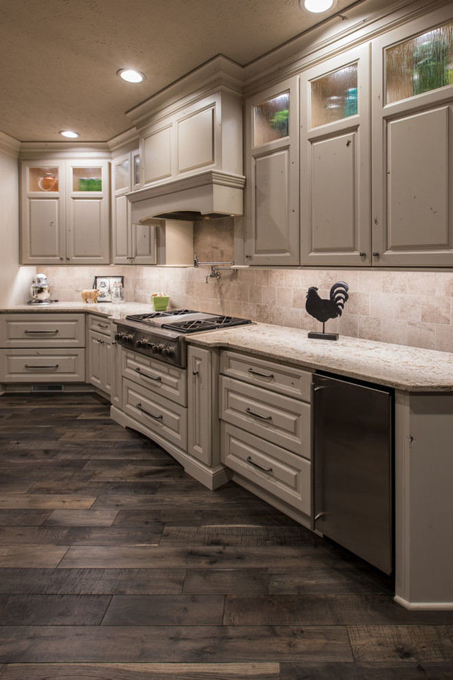 Mid-sized transitional open concept kitchen photo with raised-panel cabinets, white cabinets, quartz countertops, stainless steel appliances and an island