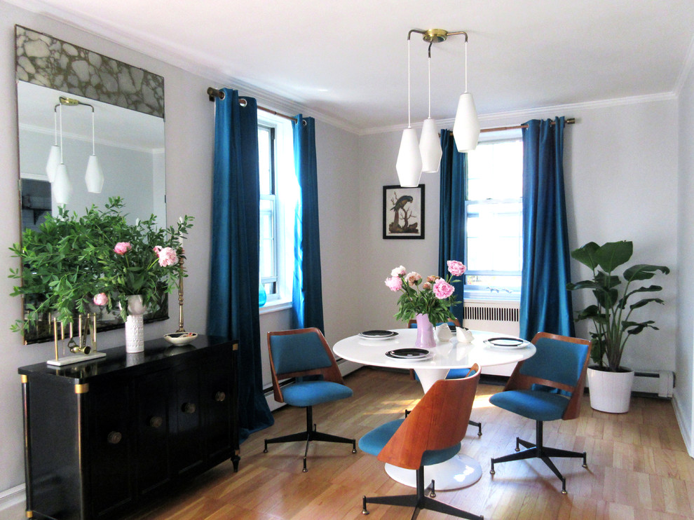 Small 1950s light wood floor and beige floor enclosed dining room photo in New York with gray walls and no fireplace