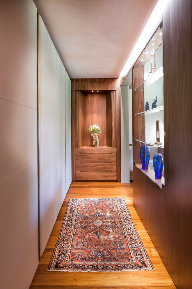 Inspiration for a large contemporary hallway in Venice with medium hardwood floors.