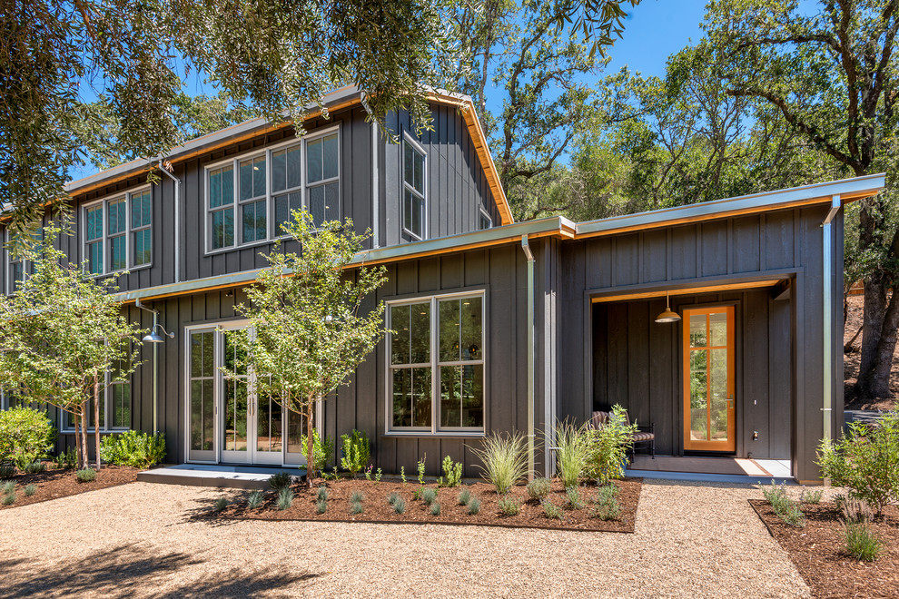 This is an example of a transitional two-storey grey exterior in San Francisco with wood siding.