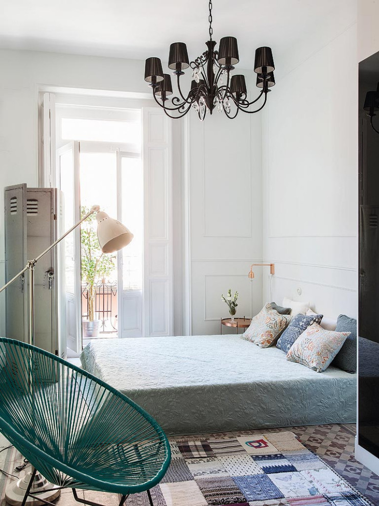 Photo of a mid-sized contemporary master bedroom in Madrid with grey walls, terra-cotta floors and multi-coloured floor.