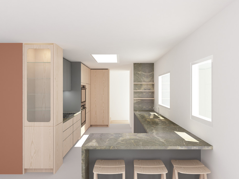 Mid-sized modern galley eat-in kitchen in San Francisco with flat-panel cabinets, light wood cabinets, marble benchtops, stainless steel appliances, a peninsula, green benchtop, linoleum floors and grey floor.
