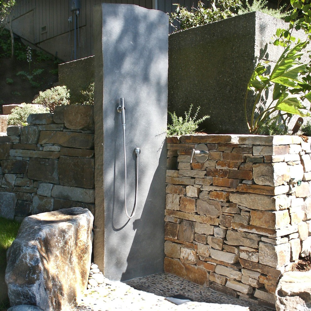 This is an example of a beach style patio in Seattle with an outdoor shower.