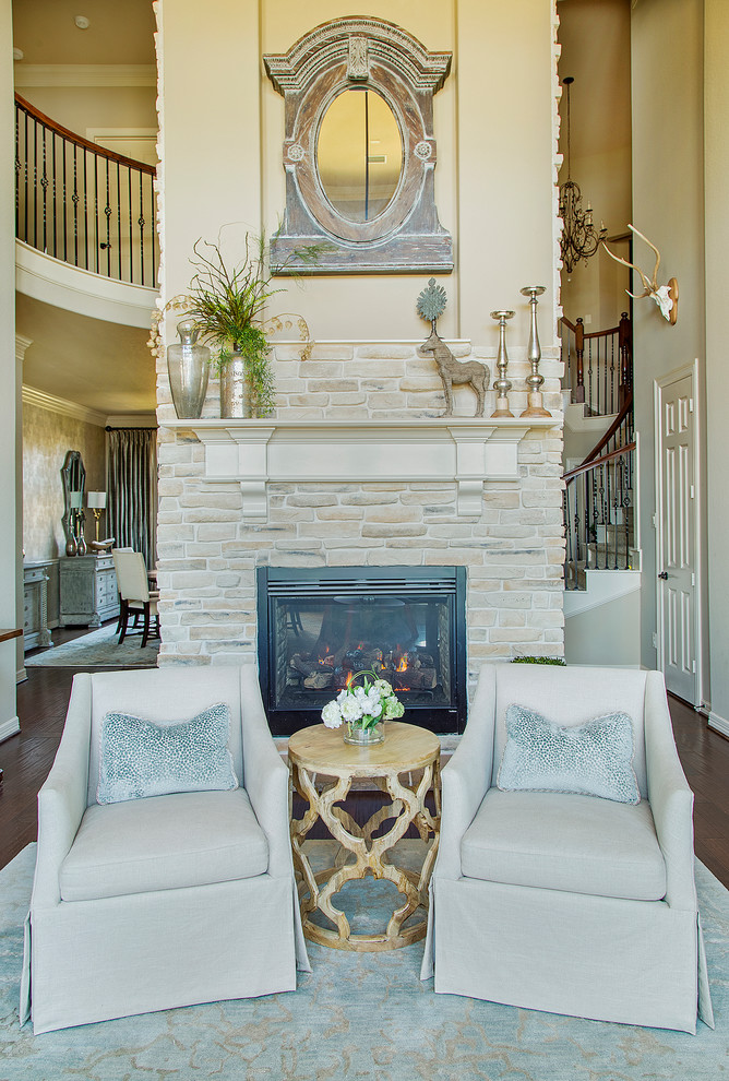 Example of a mid-sized classic formal and open concept medium tone wood floor and brown floor living room design in Other with beige walls, a two-sided fireplace and a stone fireplace