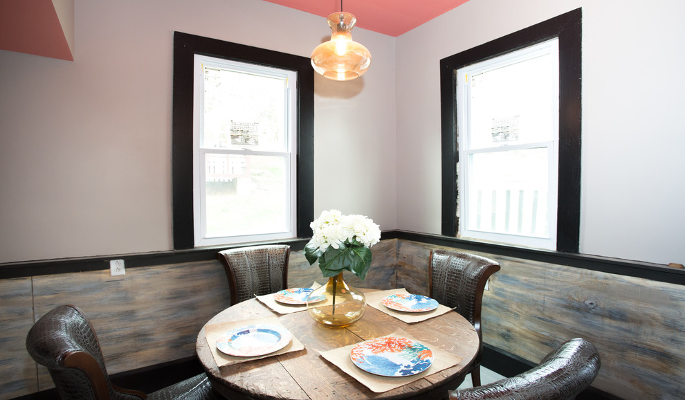 Example of a small transitional l-shaped vinyl floor and white floor enclosed dining room design with a double-bowl sink, recessed-panel cabinets, black cabinets, laminate countertops, white backsplash, subway tile backsplash, stainless steel appliances and gray countertops