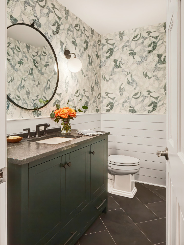 Small traditional cloakroom in Chicago with shaker cabinets, green cabinets, a one-piece toilet, multi-coloured walls, porcelain flooring, a submerged sink, marble worktops, black floors, black worktops, a built in vanity unit and tongue and groove walls.