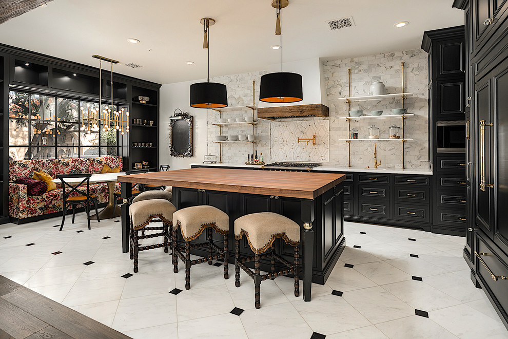 Photo of an expansive industrial u-shaped eat-in kitchen in Phoenix with an undermount sink, recessed-panel cabinets, black cabinets, wood benchtops, multi-coloured splashback, porcelain splashback, panelled appliances, marble floors, with island, multi-coloured floor and multi-coloured benchtop.