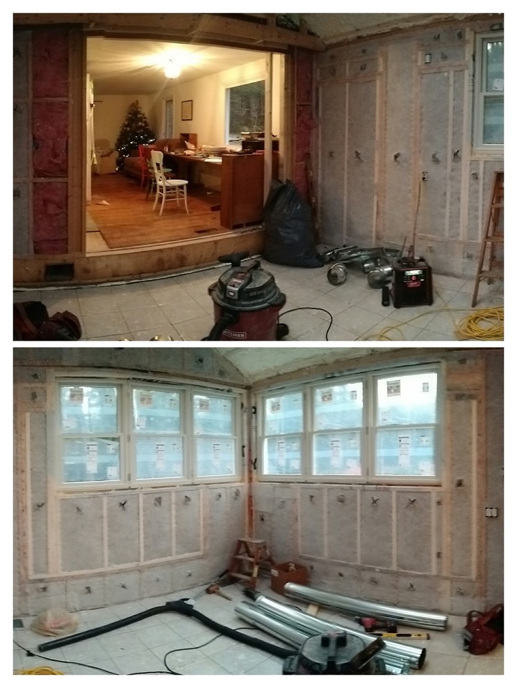 Example of a small transitional u-shaped light wood floor kitchen design with a farmhouse sink, beaded inset cabinets, white cabinets, soapstone countertops, white backsplash, white appliances and no island