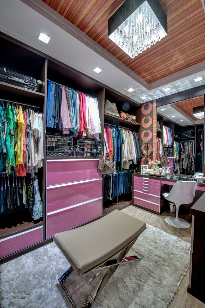 Photo of a large contemporary women's storage and wardrobe in Other.