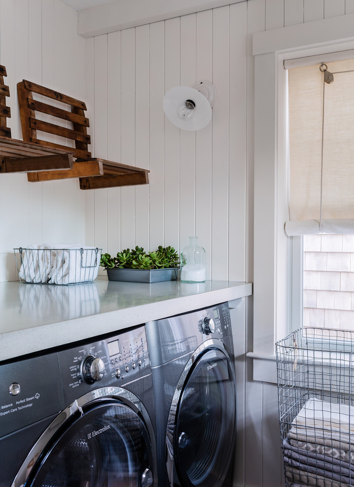 Transitional galley utility room in Boston with concrete benchtops, white walls, marble floors, a side-by-side washer and dryer and blue floor.