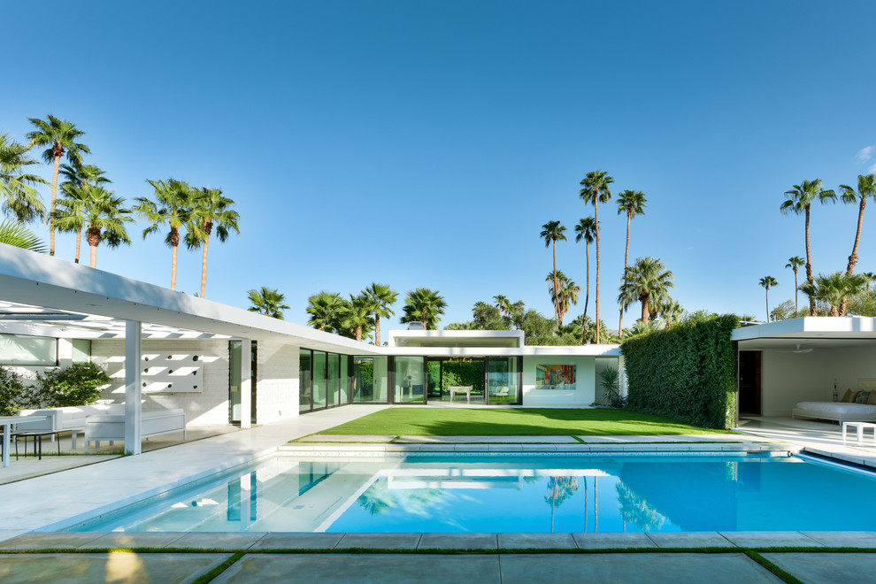 Photo of a midcentury courtyard rectangular pool in Los Angeles.