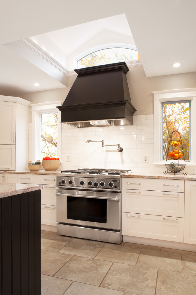 Inspiration for a traditional kitchen in DC Metro with shaker cabinets, subway tile splashback and stainless steel appliances.