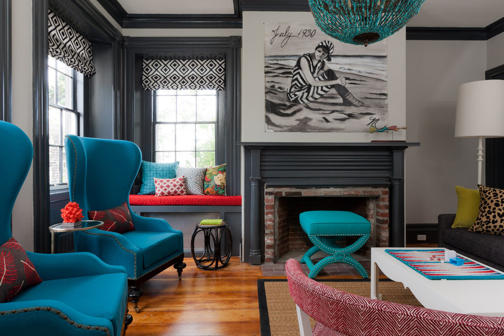 This is an example of an eclectic enclosed living room in Boston with a brick fireplace surround, grey walls, light hardwood floors, a standard fireplace and no tv.