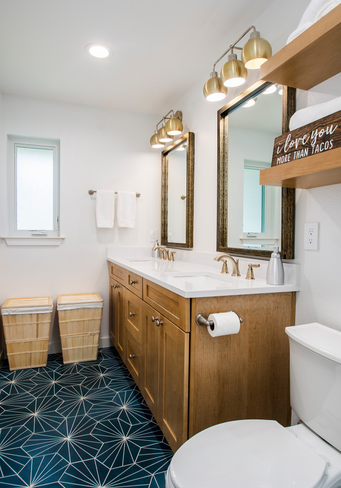 Inspiration for a mid-sized transitional master bathroom in Dallas with a two-piece toilet, white tile, white walls, porcelain floors, an undermount sink, engineered quartz benchtops, white benchtops, shaker cabinets, medium wood cabinets and blue floor.