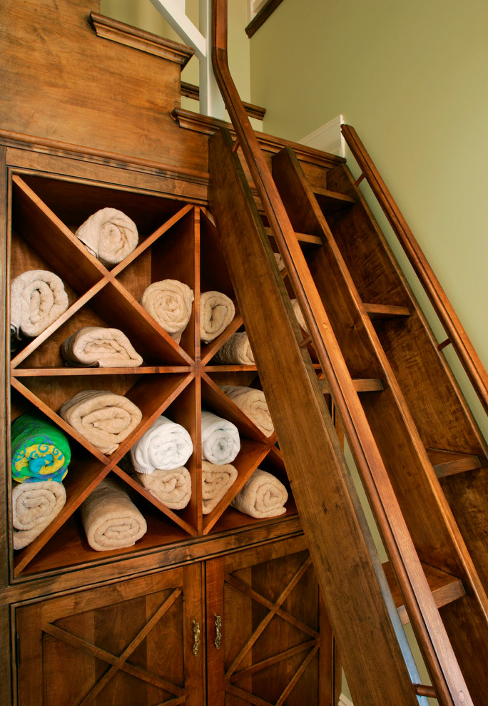 Inspiration for a small traditional built-in wardrobe in Philadelphia with open cabinets and medium wood cabinets.