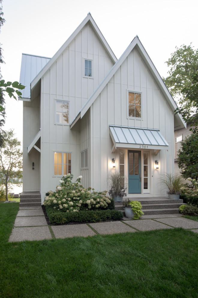 Transitional white exterior in Detroit with a gable roof.