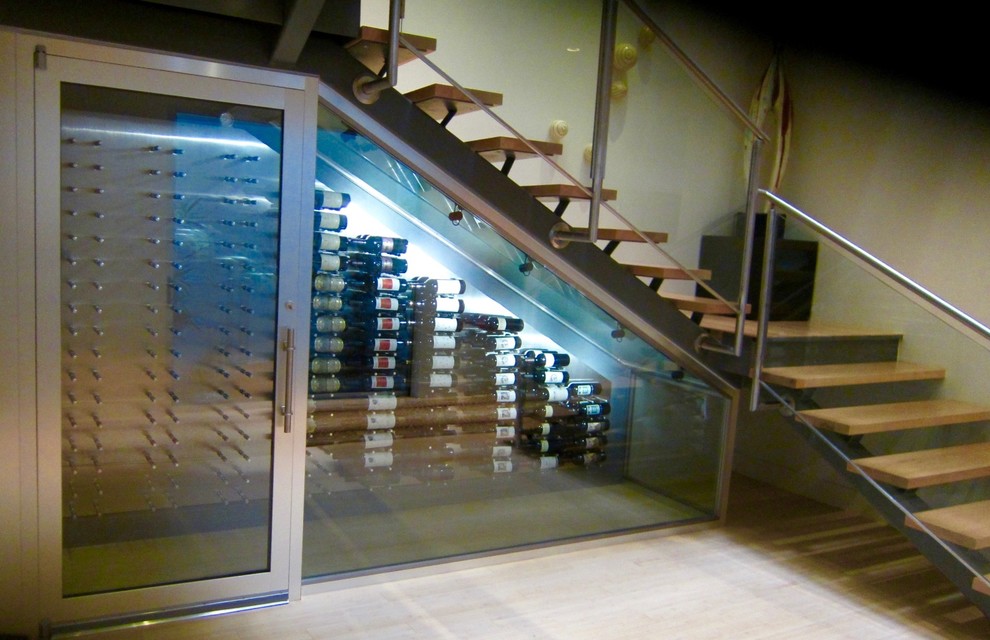 Small contemporary wine cellar in Dallas with bamboo floors and storage racks.