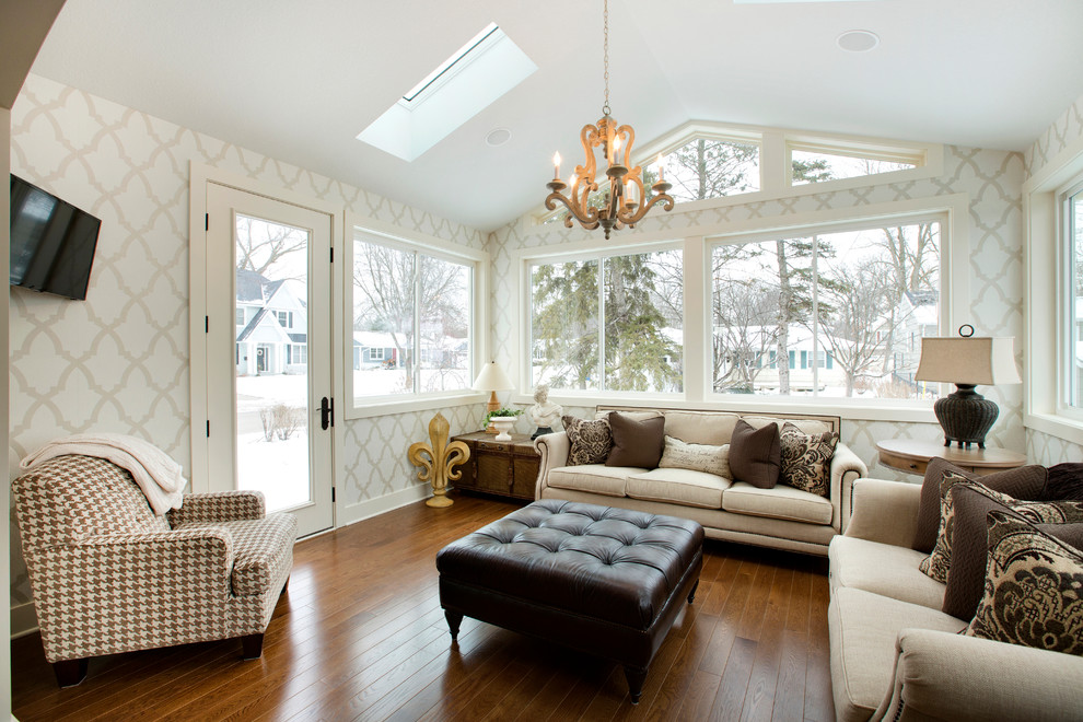 This is an example of a large traditional sunroom in Minneapolis with dark hardwood floors and a skylight.