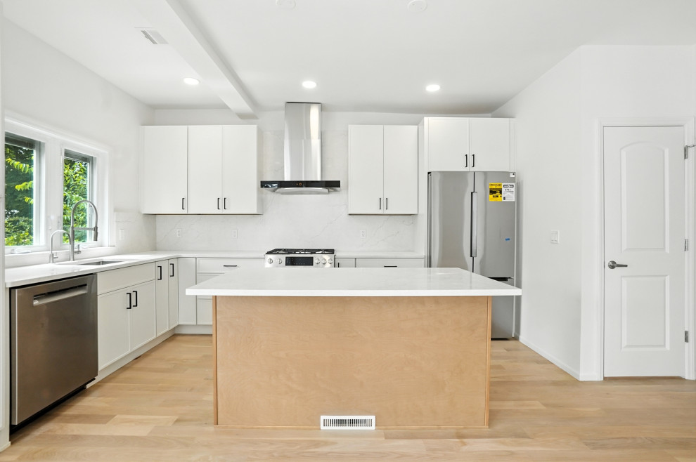 L-Shaped White Kitchen with Center Island