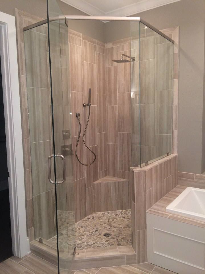 Inspiration for a large transitional master beige tile light wood floor alcove shower remodel in New Orleans with flat-panel cabinets, a one-piece toilet and beige walls