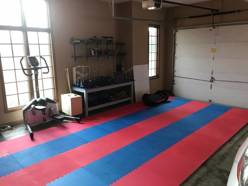 This is an example of a mid-sized multipurpose gym in Minneapolis with multi-coloured floor.
