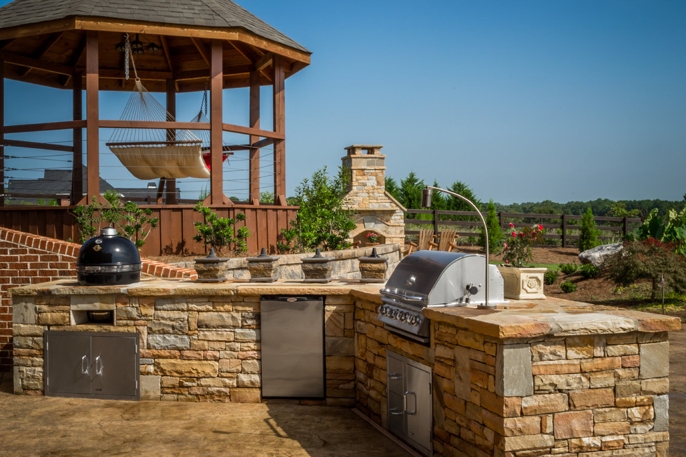 Design ideas for a country backyard patio in Atlanta with an outdoor kitchen, stamped concrete and no cover.
