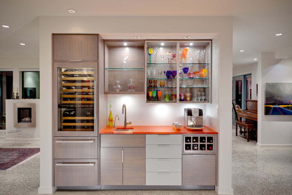 Inspiration for a contemporary single-wall wet bar in Vancouver with an undermount sink, flat-panel cabinets, light wood cabinets, white splashback and orange benchtop.