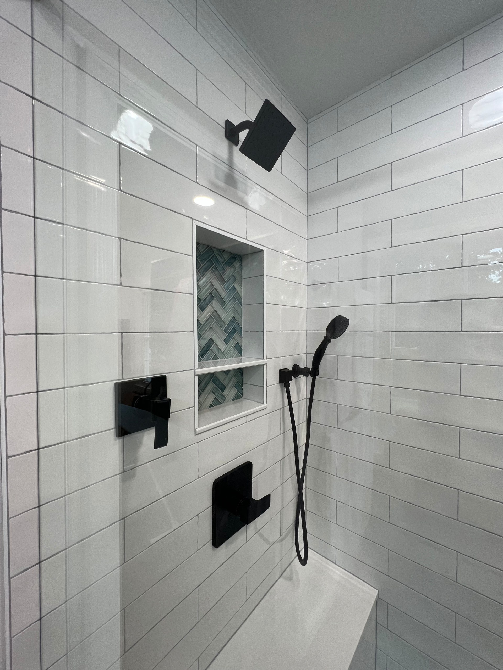 Walk in shower with custom stained vanity