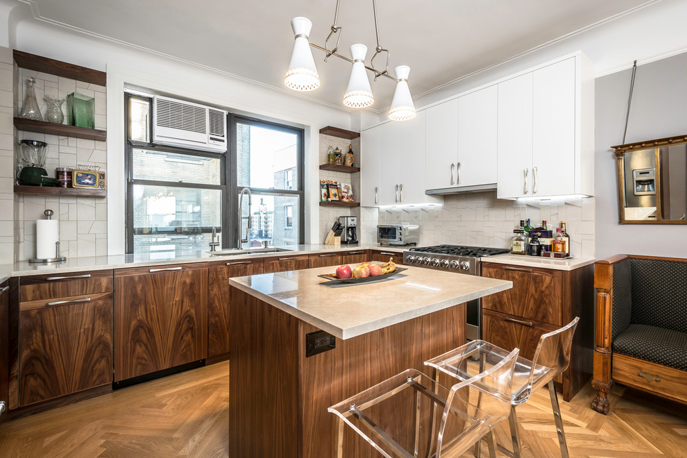 This is an example of a mid-sized contemporary u-shaped separate kitchen in New York with an undermount sink, flat-panel cabinets, dark wood cabinets, white splashback, stainless steel appliances, medium hardwood floors, with island, quartzite benchtops and ceramic splashback.