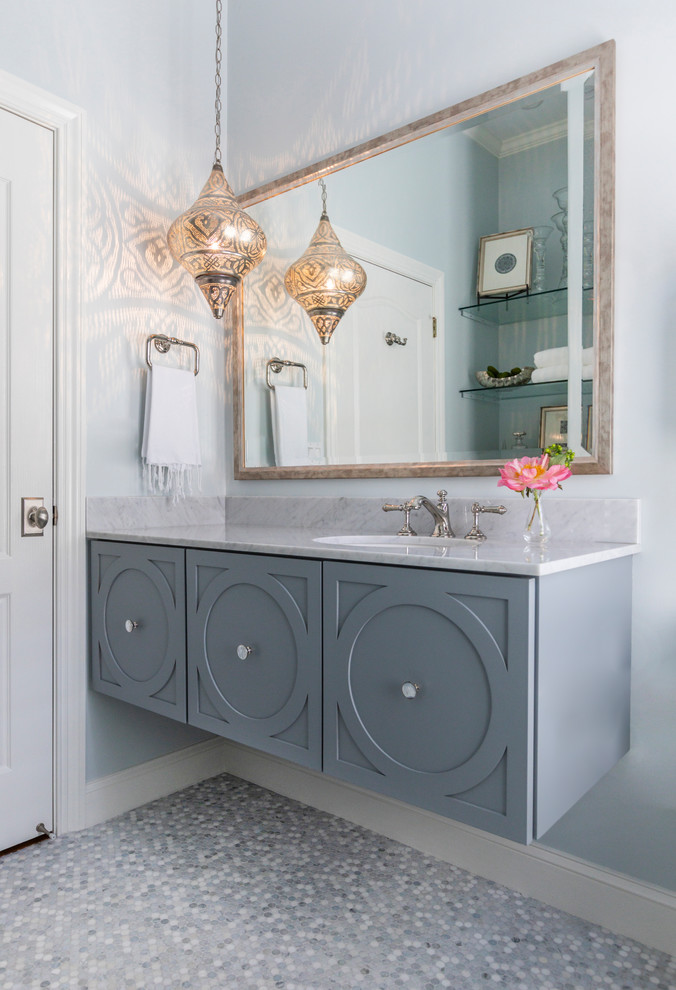 Mid-sized transitional powder room in Jacksonville with marble, grey walls, an undermount sink, marble benchtops, grey benchtops, grey cabinets, mosaic tile floors and grey floor.