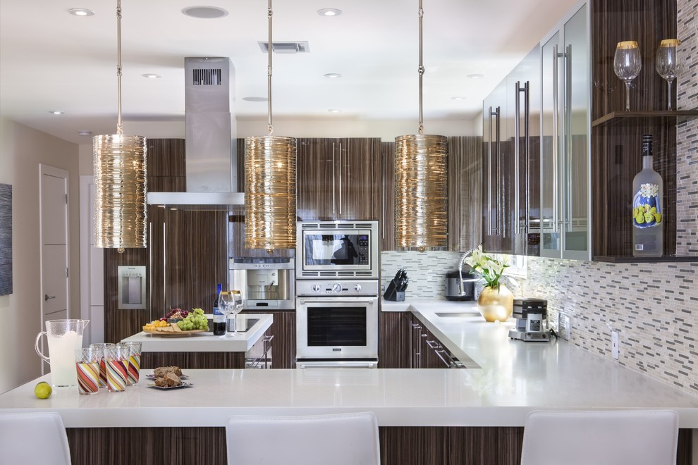 Photo of a large transitional l-shaped eat-in kitchen in Miami with flat-panel cabinets, brown cabinets, quartz benchtops, multi-coloured splashback, matchstick tile splashback, stainless steel appliances, marble floors, with island and an undermount sink.