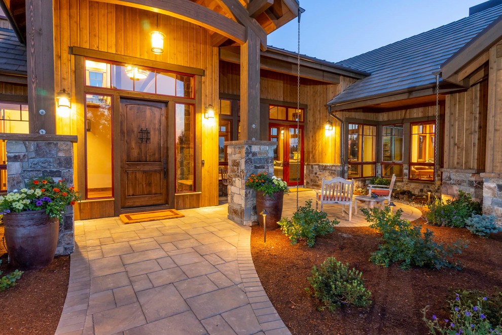 Large mountain style brown two-story wood gable roof photo
