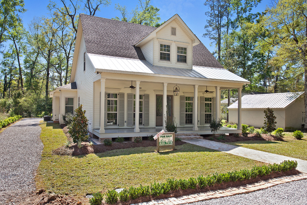 Traditional two-storey white exterior in New Orleans with concrete fiberboard siding.