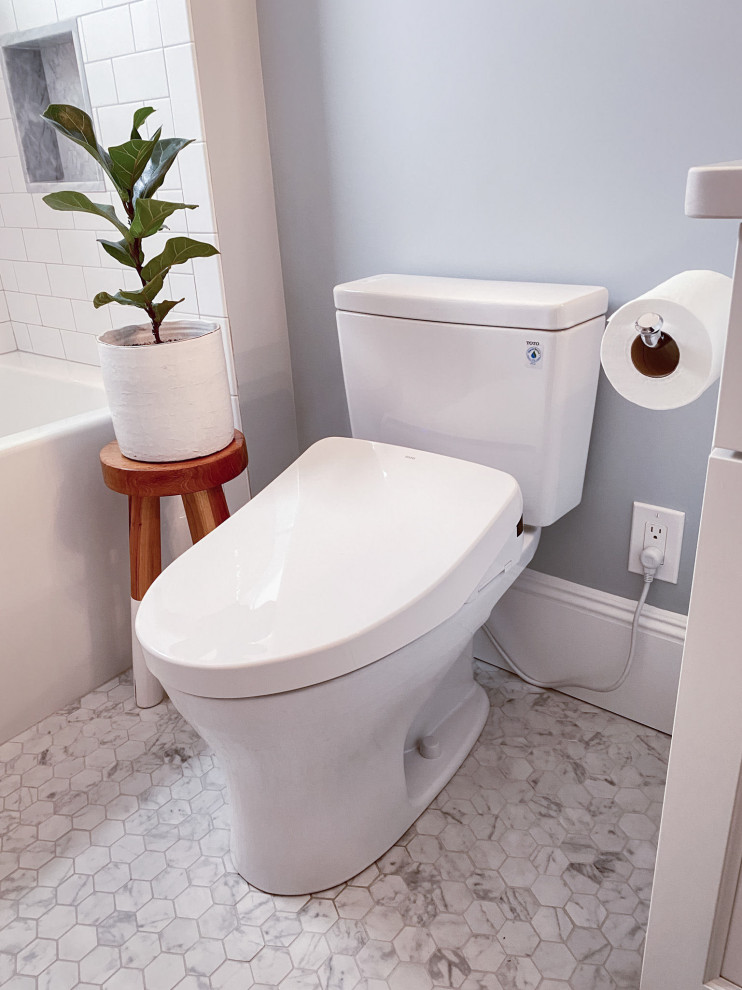 Inspiration for a timeless master white tile and subway tile mosaic tile floor, gray floor and double-sink bathroom remodel in Boston with shaker cabinets, white cabinets, a bidet, blue walls, an undermount sink, quartz countertops, white countertops, a niche and a built-in vanity