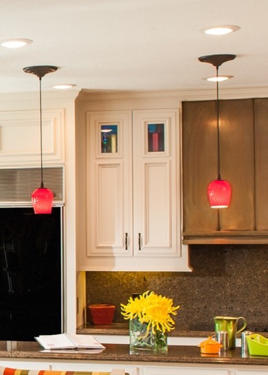 Large transitional u-shaped marble floor eat-in kitchen photo in Houston with a drop-in sink, recessed-panel cabinets, white cabinets, granite countertops, brown backsplash, stone tile backsplash, black appliances and an island