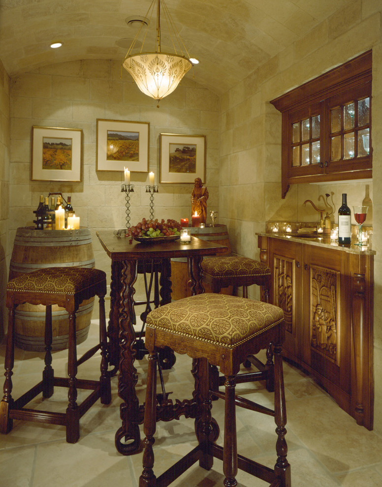 Design ideas for a mid-sized traditional wine cellar in San Francisco with limestone floors.