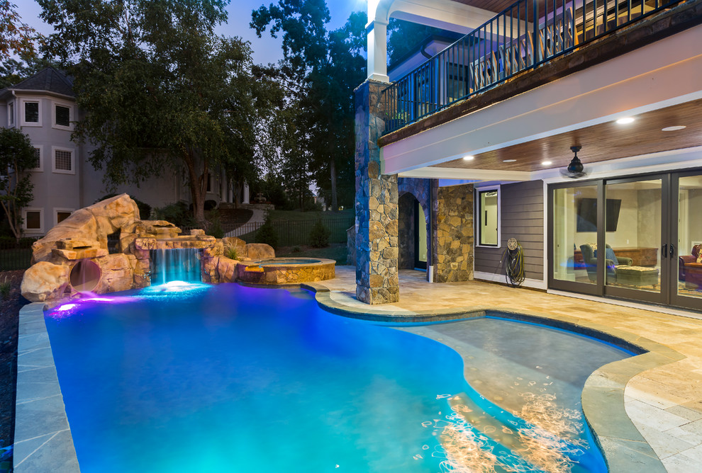 Inspiration for a large rustic indoor stone and custom-shaped indoor water slide remodel in Charlotte