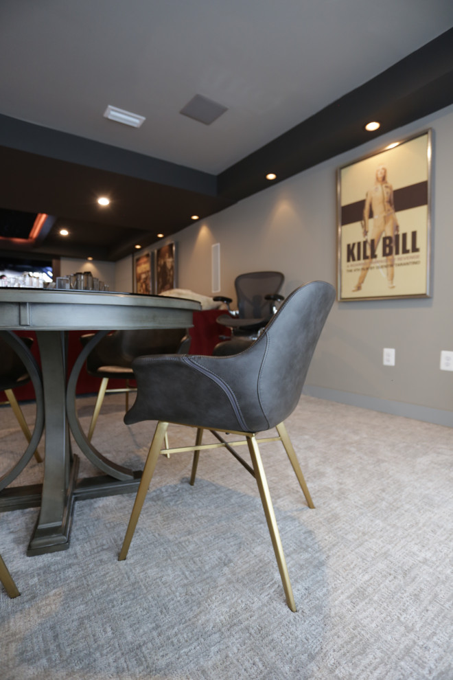 This is an example of a large contemporary open concept family room in DC Metro with a game room, beige walls, carpet, a built-in media wall and grey floor.