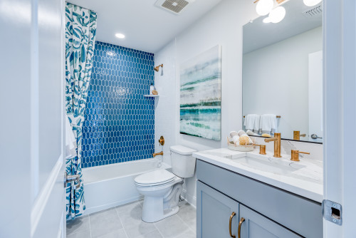 Soft Blue Vanity Magic: Combine Quartz Countertops and Glossy Blue Hexagons for Artful Bathrooms