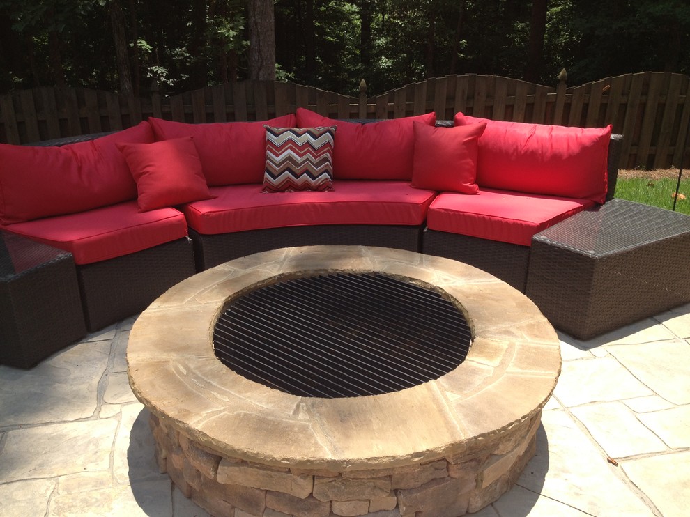 Inspiration for a mid-sized traditional backyard patio in Atlanta with a fire feature, stamped concrete and no cover.