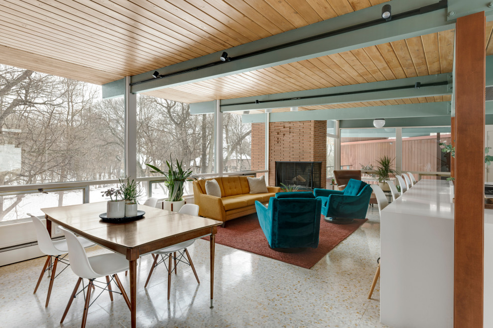 Design ideas for a mid-sized midcentury open concept living room in Minneapolis with white walls, a corner fireplace, a brick fireplace surround, white floor, exposed beam and wood walls.
