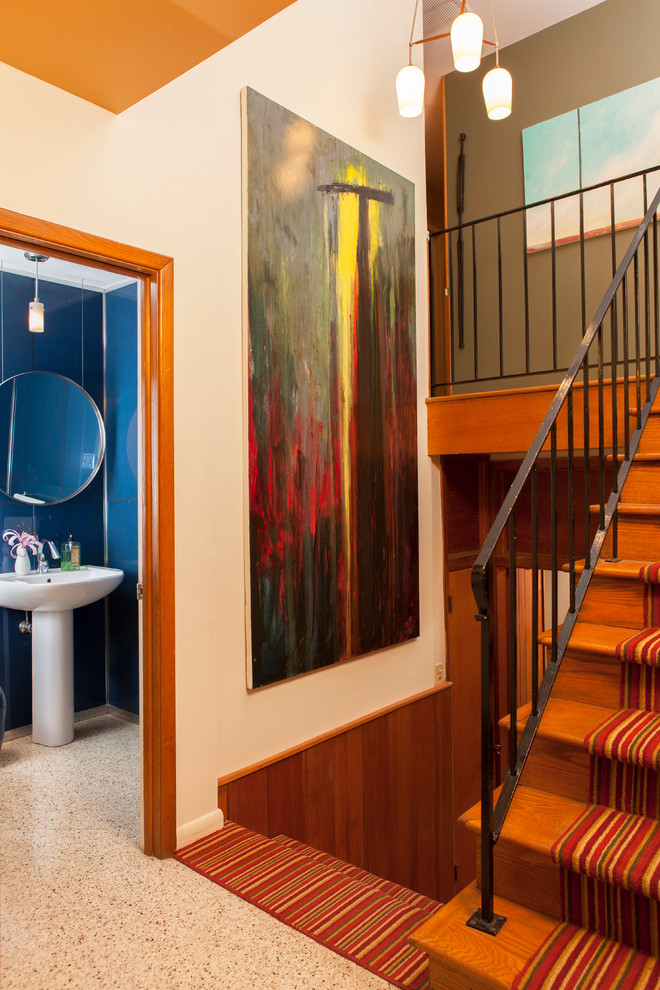 This is an example of a midcentury wood staircase in Atlanta with wood risers.