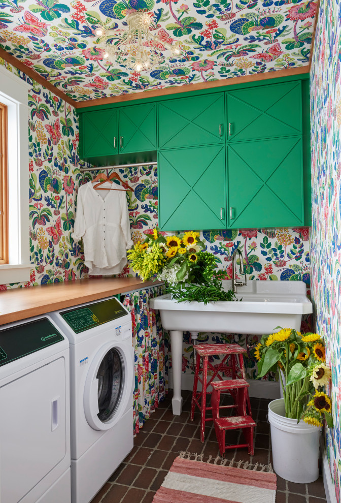 Design ideas for an eclectic laundry room in Other with green cabinets, wood benchtops, brick floors, wallpaper and wallpaper.