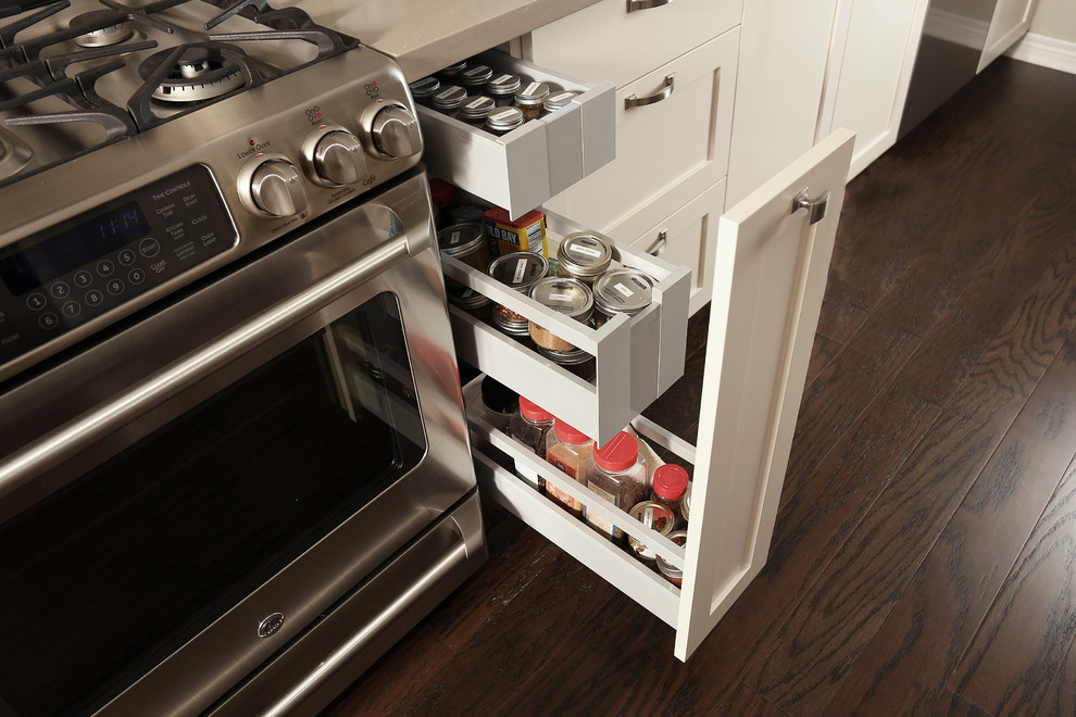 Mid-sized transitional galley dark wood floor and brown floor open concept kitchen photo with an undermount sink, shaker cabinets, beige cabinets, quartz countertops, beige backsplash, porcelain backsplash, stainless steel appliances and no island