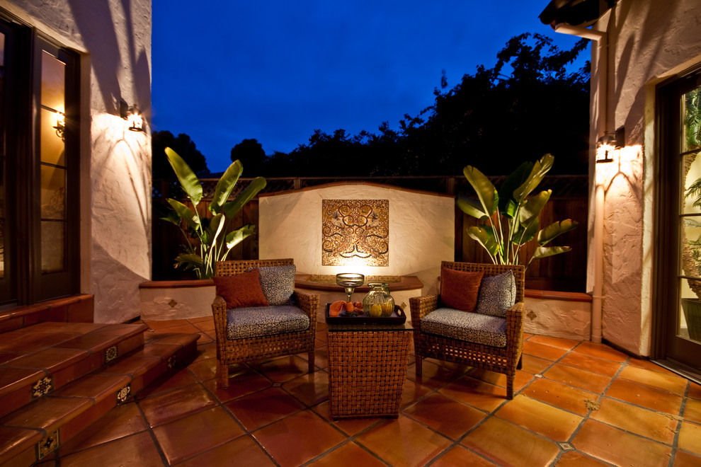 Photo of a mid-sized mediterranean courtyard patio in San Francisco with a water feature.