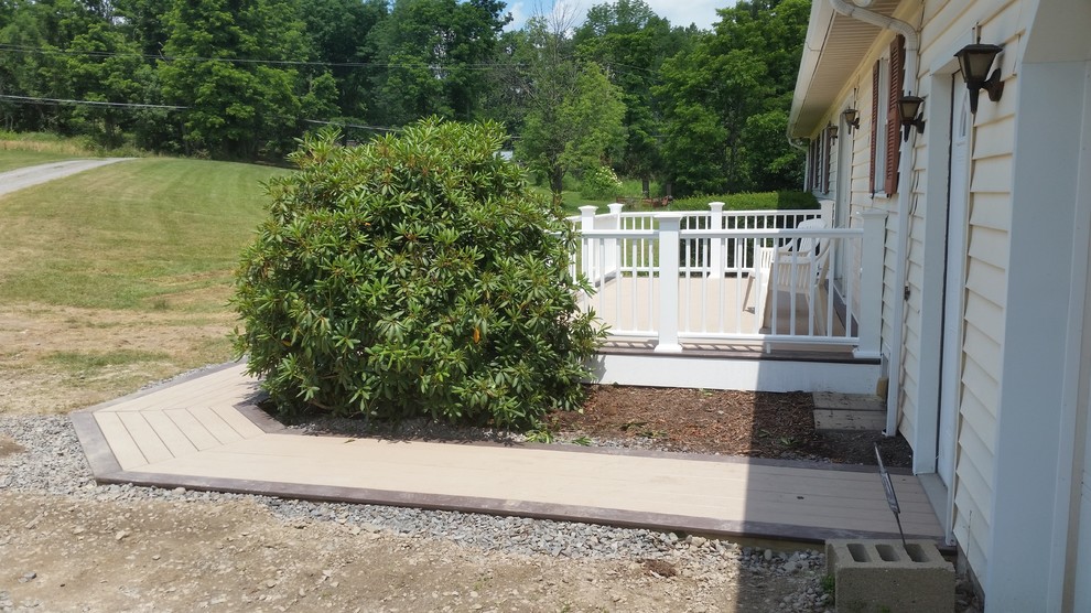 Mid-sized side yard deck photo with no cover