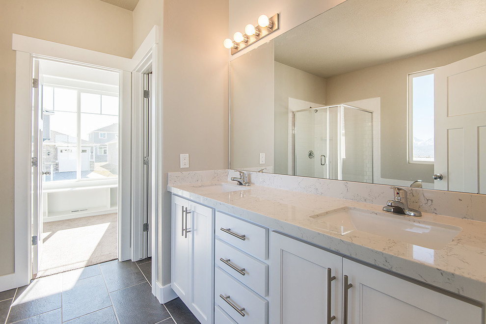 Large arts and crafts master bathroom in Salt Lake City with an undermount sink, shaker cabinets, white cabinets, engineered quartz benchtops, a drop-in tub, an open shower, a one-piece toilet, gray tile, ceramic tile, grey walls and ceramic floors.