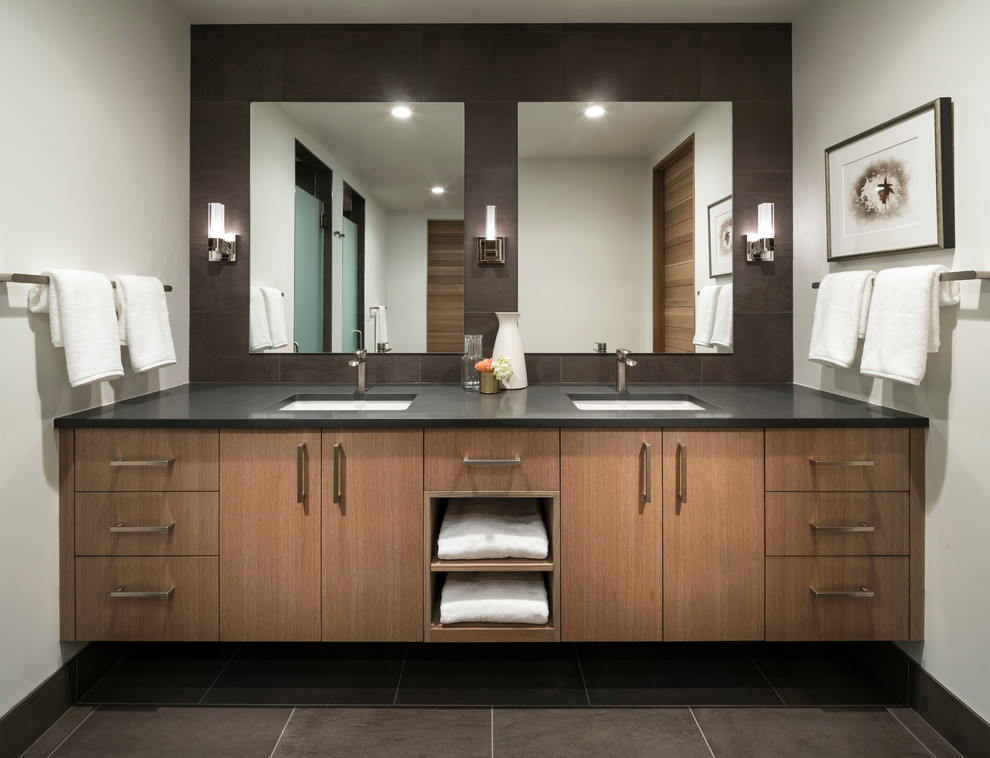 Design ideas for a contemporary bathroom in Other with flat-panel cabinets, medium wood cabinets, white walls, an undermount sink, grey floor, grey benchtops and brown tile.