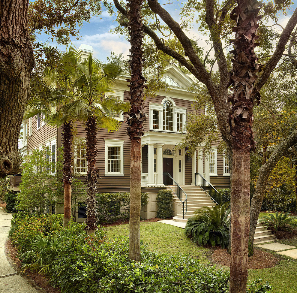 Photo of a traditional exterior in Charleston with wood siding.