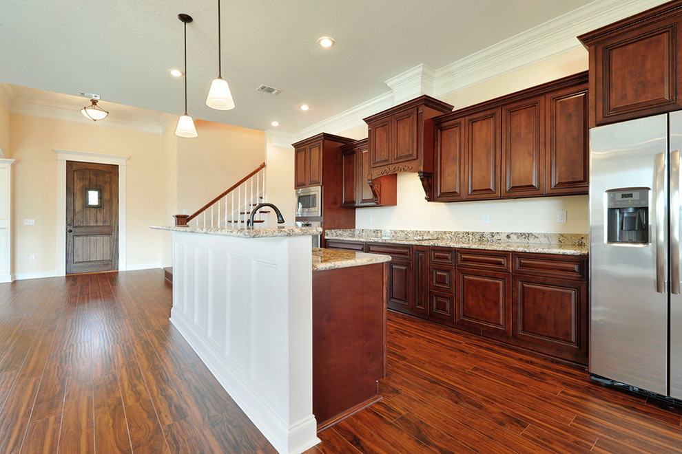 Open concept kitchen - mid-sized transitional galley dark wood floor open concept kitchen idea with an undermount sink, beaded inset cabinets, dark wood cabinets, granite countertops, stainless steel appliances and an island